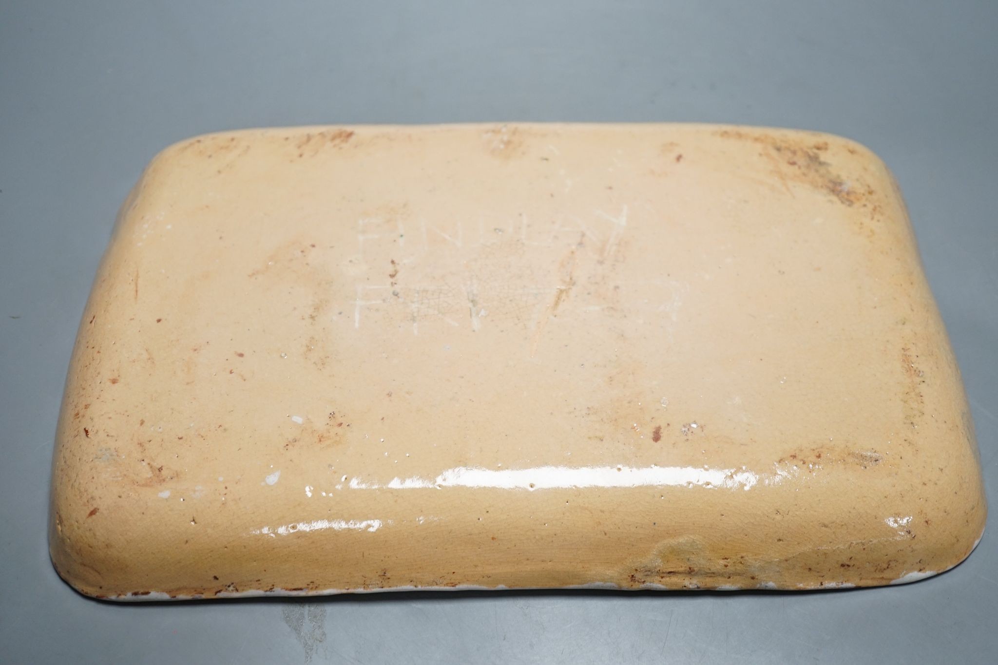 A slipware baking dish, indistinctly signed Findlay Fri(?), 37.5 cms wide.